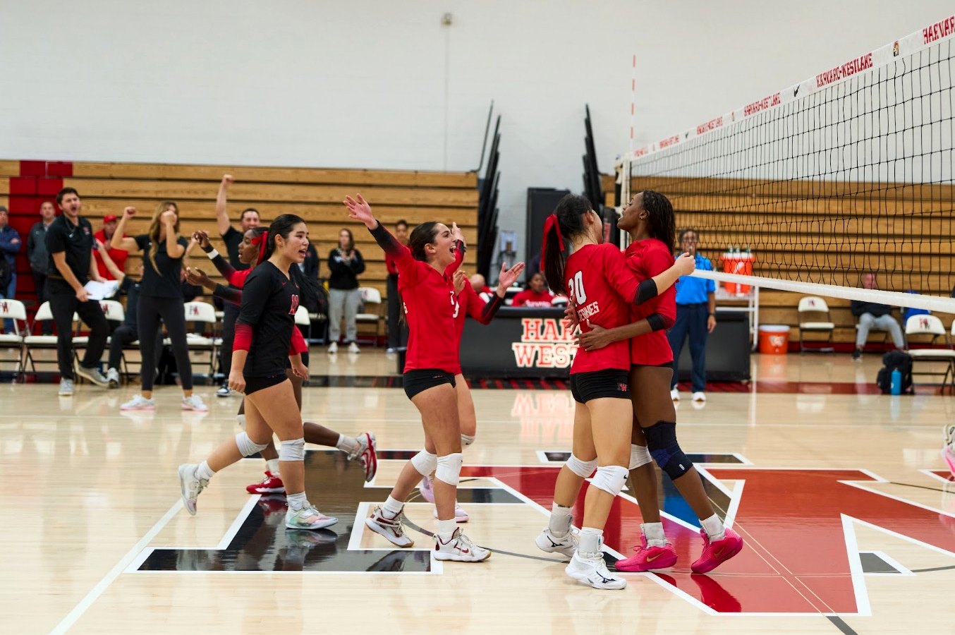 Lauryn Lewis and her teammates celebrating a point at Harvard-Westlake.